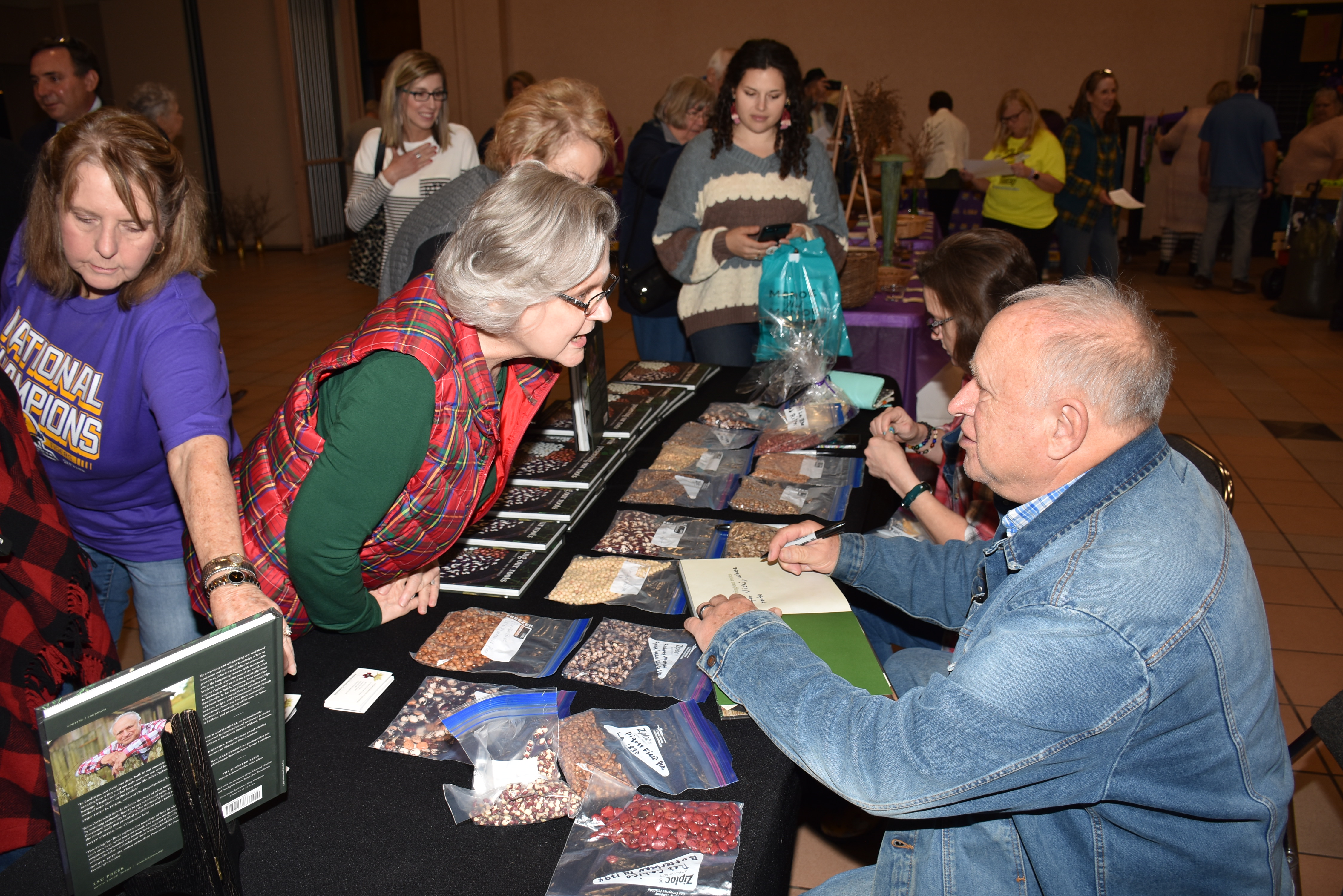 Man signing books at gardening seminar.JPG thumbnail